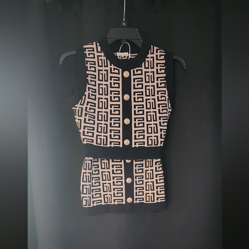 Imoddel  Women's 2 piece Top and  mini Skirt Size L. Gently Used